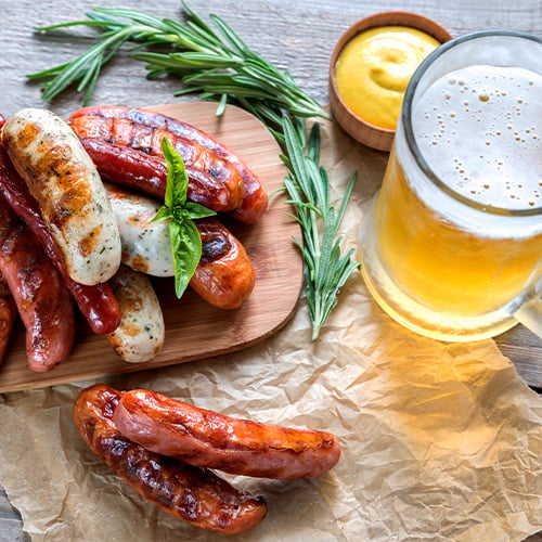 grilled sausages with glass of beer