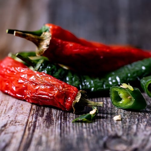 multiple dried red and green chili peppers