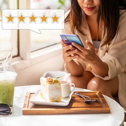 Woman reviewing food on phone