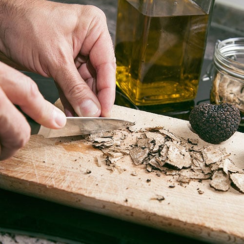 Man chopping a truffle