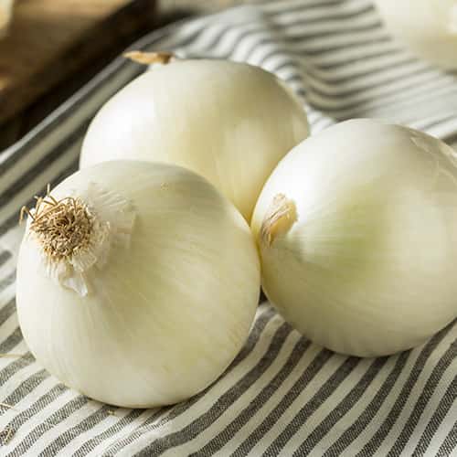 three whole White Onions