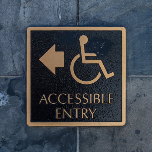 Accessible entry sign posting
