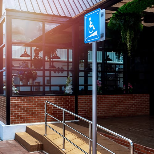 Wheelchair ramp with an ADA sign