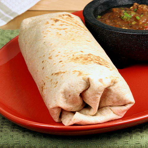 a Burrito on a red plate with salsa