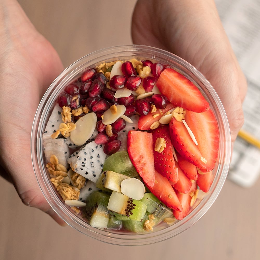 Wild acai blended with fresh strawberry and banana, topped with fresh kiwi, pomegranate, strawberry, dragonfruit, almond flakes, granola, and layered with chia pudding.