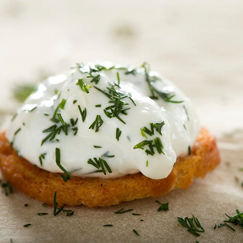 Creme Fraiche with dill on a on latkes