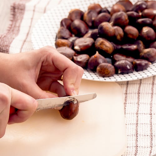 preparing sweet chestnuts for roasting in oven