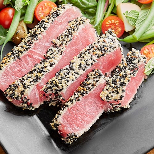 ahi tuna slices served with greens