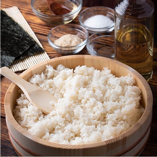 prepared sushi rice in a steamer basket