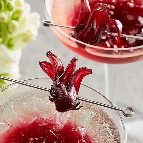 Closeup image of a garnish on the rim of a glass