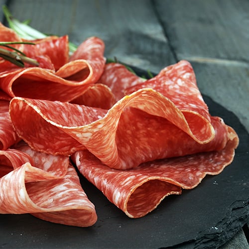 Genoa Salami on a charcuterie board