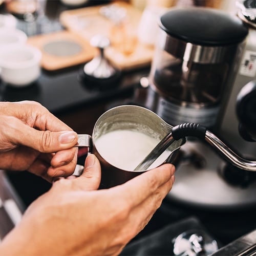 close up of frother nozzle from coffee machine
