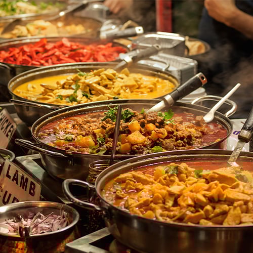 Image of Series of Indian dishes at a market