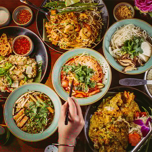 Table with multiple Thai dishes