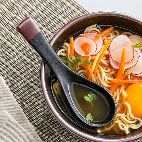 With a large, flat bottom and long handle, a Chinese soup ladle is designed for serving soups, stews, and other liquid dishes.