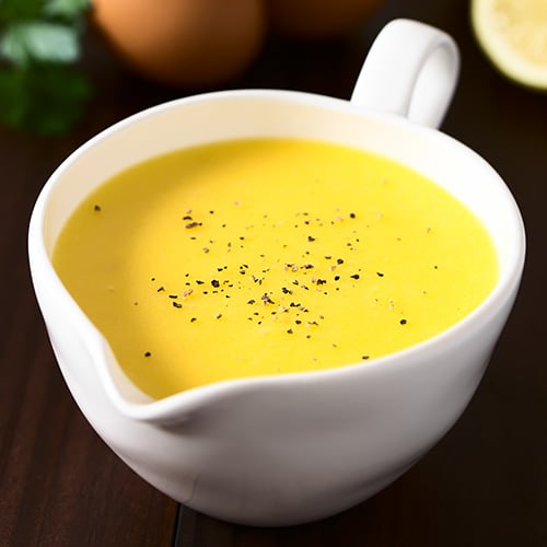 Hollandaise sauce in a serving container