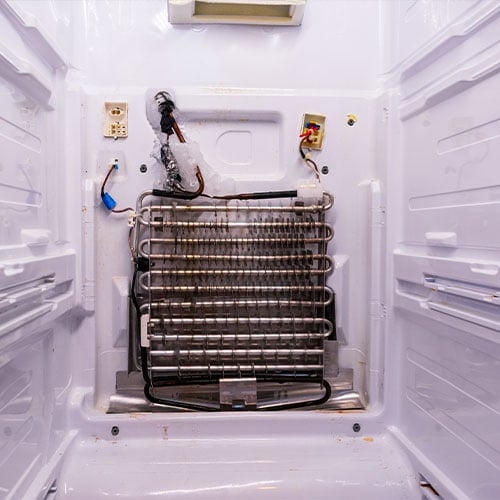 frozen evaporator coils in a refrigerator