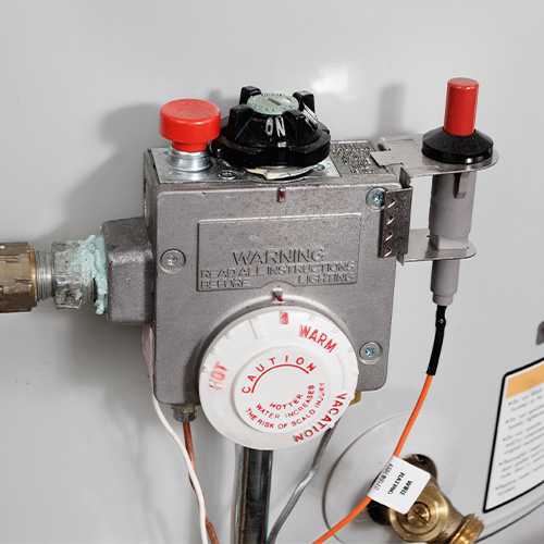 close up view of water heater thermostat