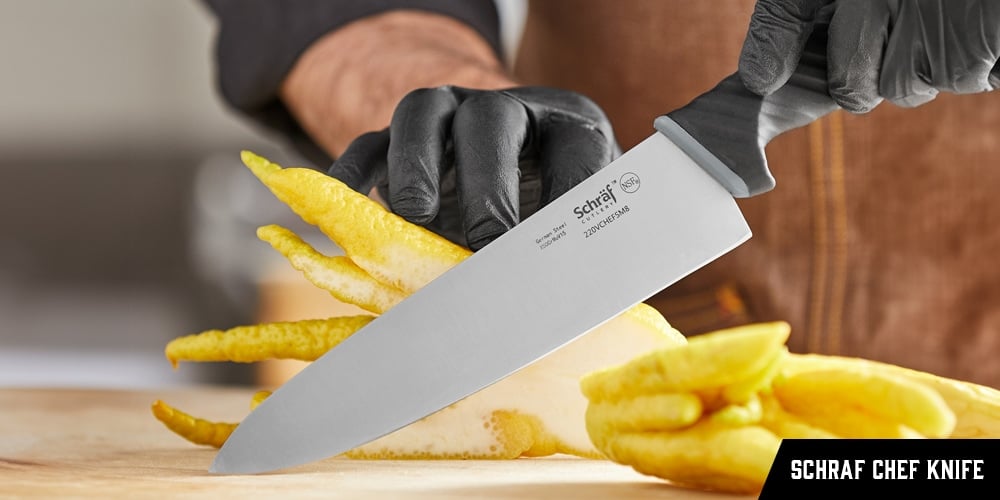 A chef using a Schraf Chef Knife to cut a vegetable