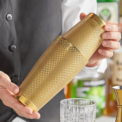Person holding a cocktail shaker