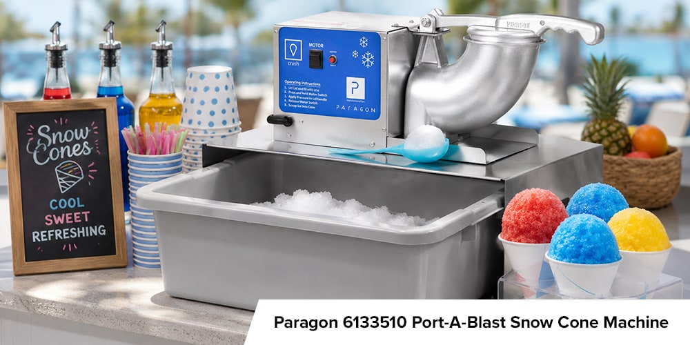 Paragon Port-A-Blast snow cone machine on a bright outdoor counter with syrup bottles, cups, ice, and colorful snow cones.