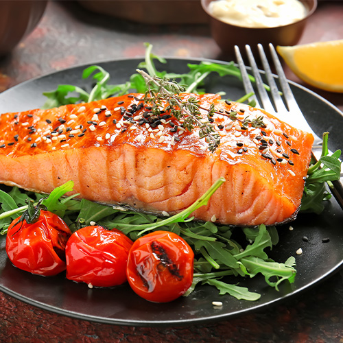 Plated salmon with fresh greens