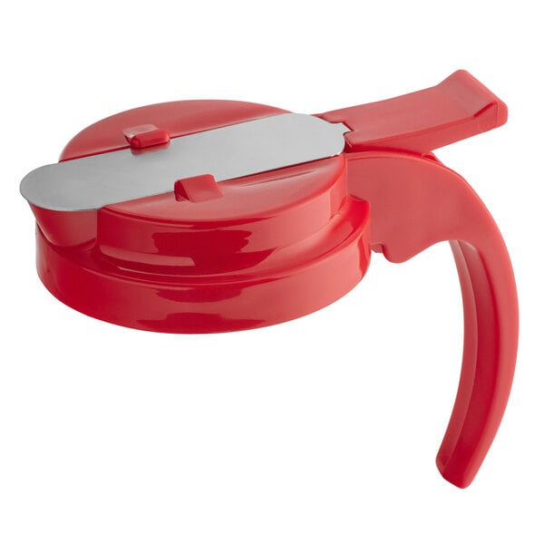 A red plastic top for a syrup server.