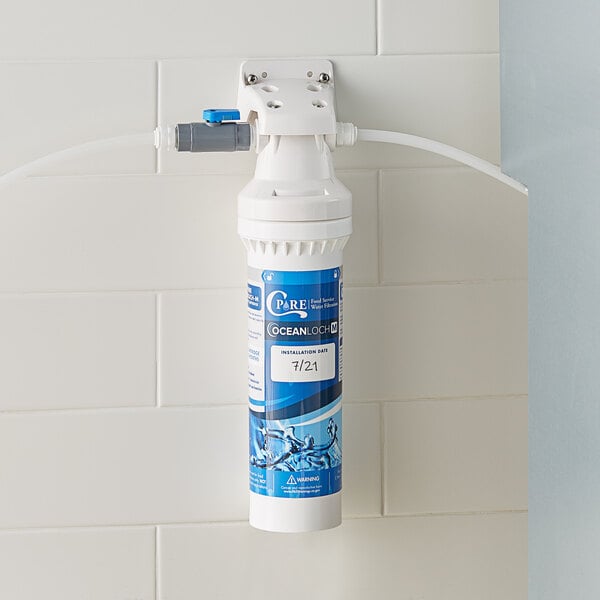A C Pure Oceanloch-M water filtration system attached to a wall.