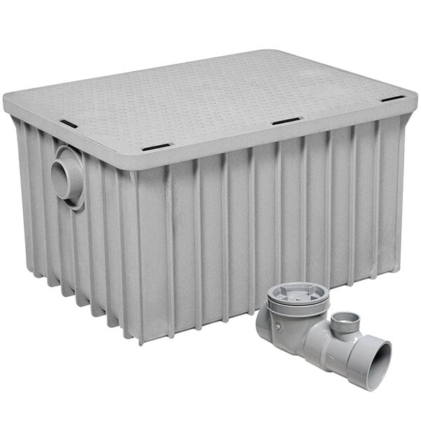 A grey plastic container with a pipe and drain.