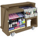 A brown plastic Cambro portable bar with bottles of beverages.