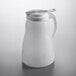 A white plastic pitcher with a white lid.