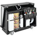A black Cambro portable bar with bottles on it.