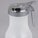 A white polypropylene Tablecraft syrup dispenser with a chrome plated lid.