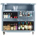 A Cambro Slate Blue portable bar cart full of bottles.